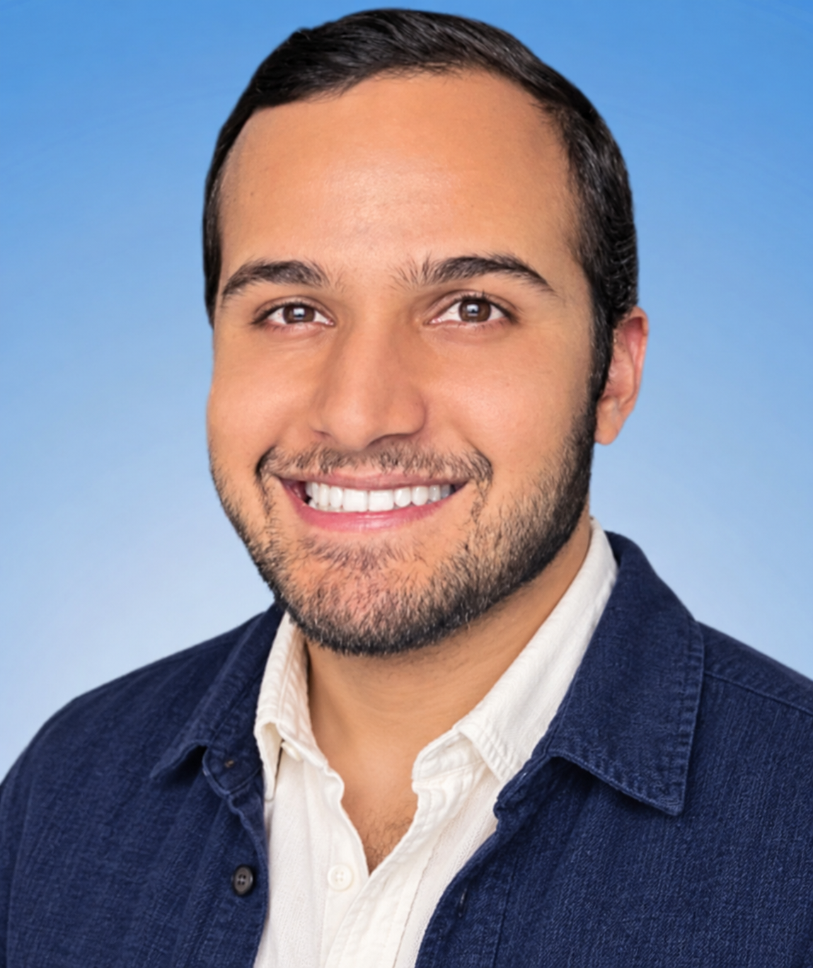 AI headshot styling concept with a navy textured overshirt, ivory open-collar shirt, short side-parted hair and a short beard.